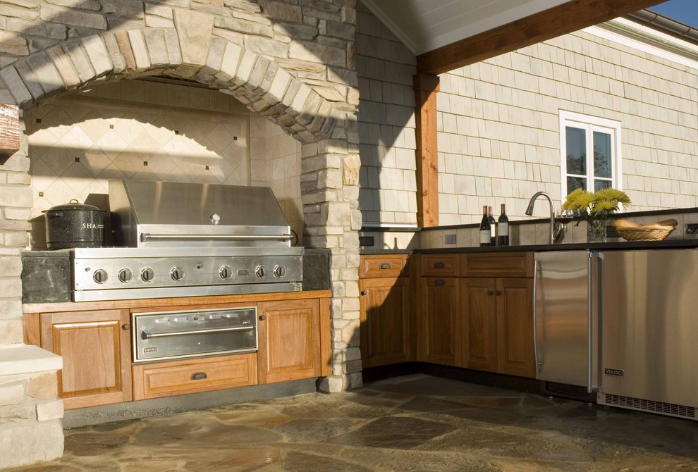 Photo of a traditional patio in Other with an outdoor kitchen.