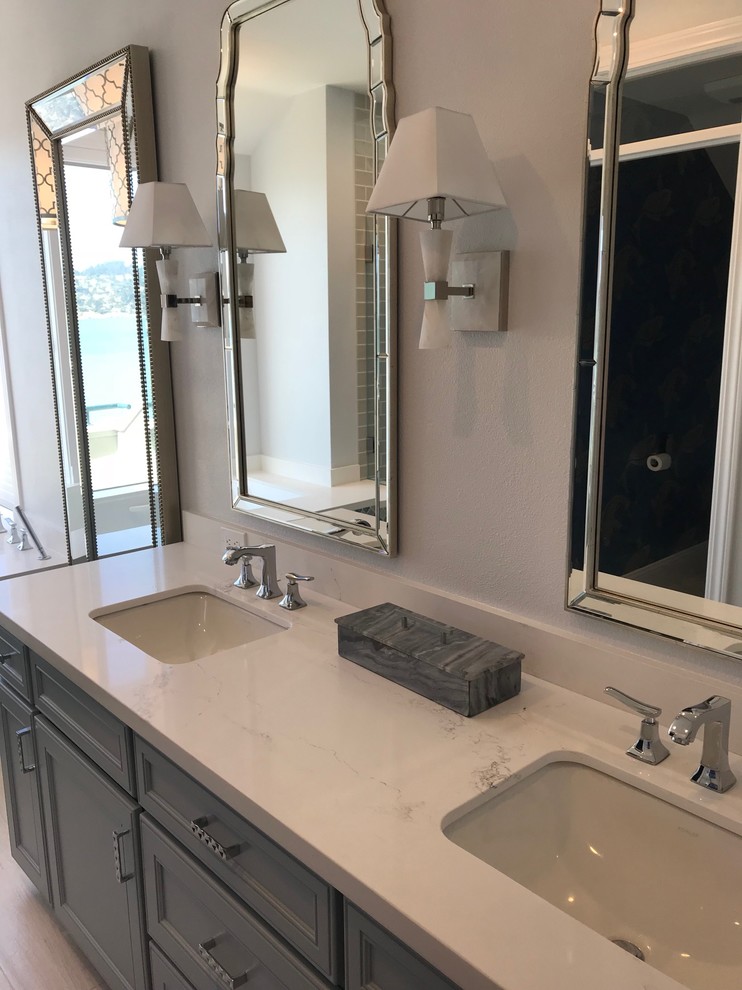 Photo of a large traditional master bathroom in San Francisco with recessed-panel cabinets, grey cabinets, grey walls, an undermount sink, marble benchtops, grey floor and white benchtops.