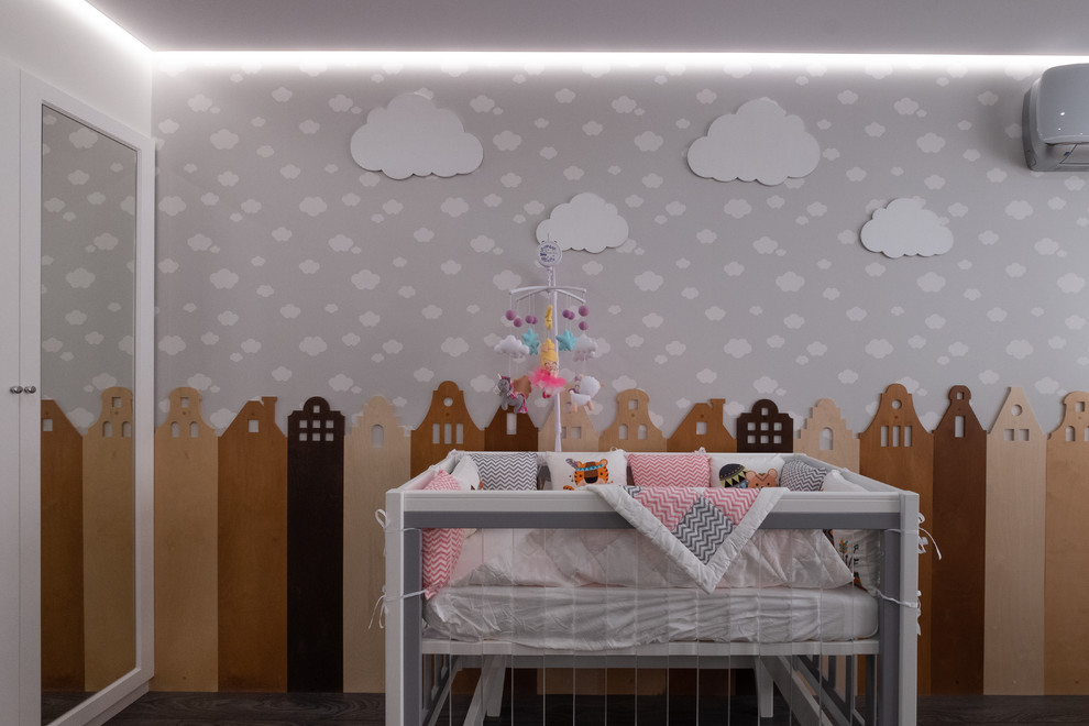 Design ideas for a mid-sized contemporary gender-neutral nursery in Moscow with grey walls, laminate floors and grey floor.