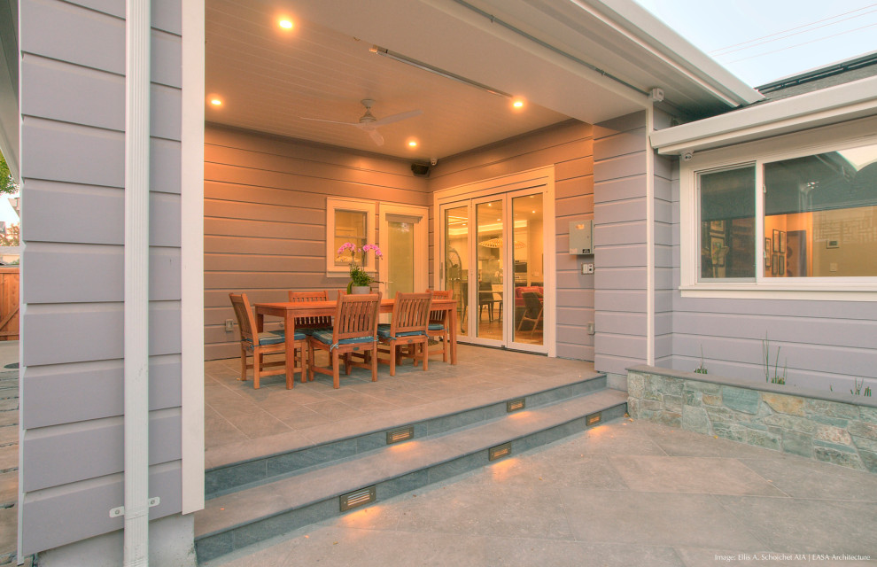 Small contemporary back patio in San Francisco with a fire feature, tiled flooring and a roof extension.