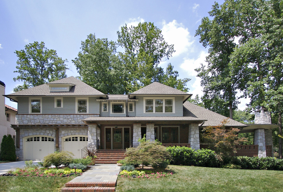 Inspiration for an arts and crafts exterior in Atlanta with wood siding and a hip roof.
