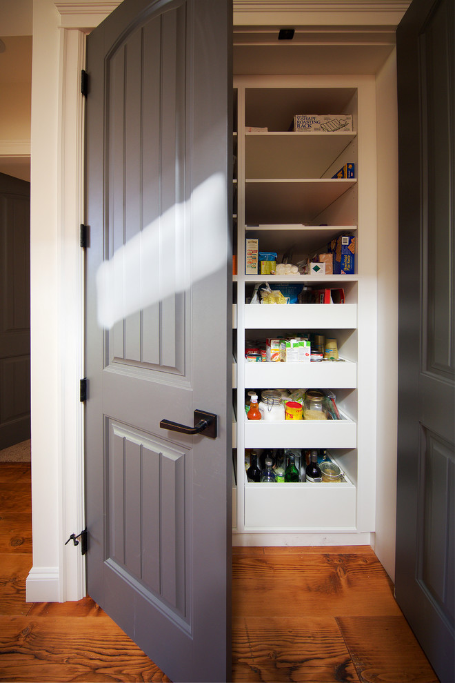 Inspiration for a mid-sized rustic galley medium tone wood floor open concept kitchen remodel in Vancouver with a double-bowl sink, beaded inset cabinets, white cabinets, brown backsplash, mosaic tile backsplash, stainless steel appliances and an island