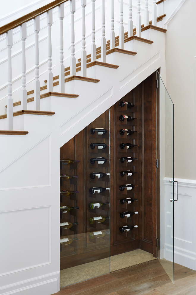 Inspiration for a mid-sized transitional wine cellar in Los Angeles with porcelain floors, diamond bins and beige floor.