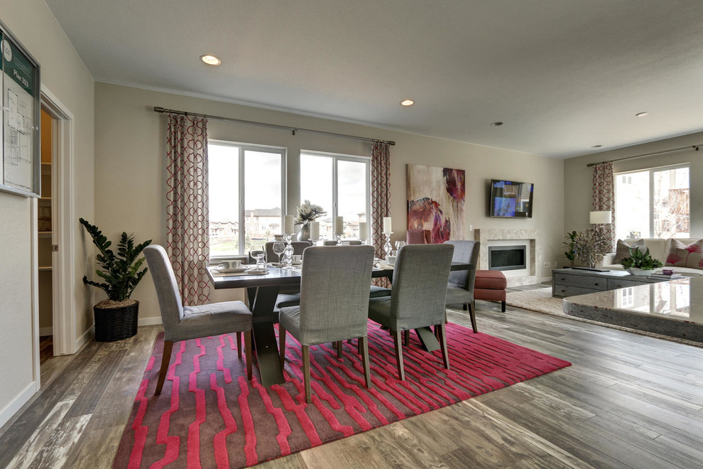 Example of a mid-sized transitional porcelain tile kitchen/dining room combo design in Denver with beige walls, a standard fireplace and a tile fireplace