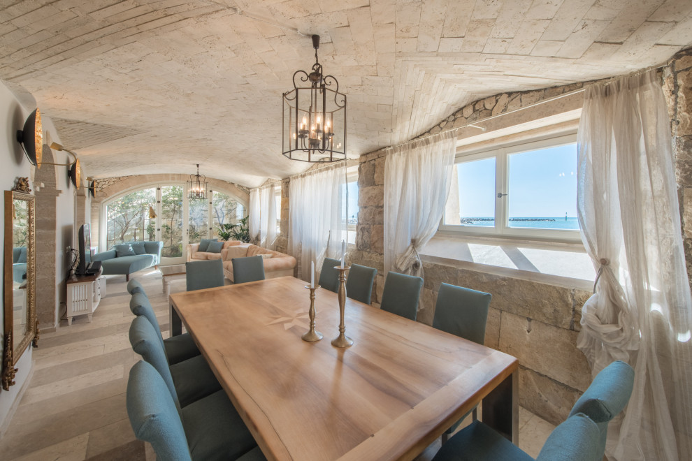 This is an example of a beach style dining room in London.