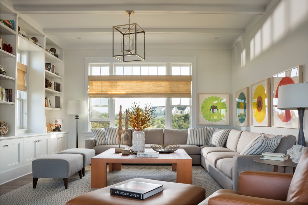 Inspiration for a large beach style family room in New York with white walls, a library and no fireplace.