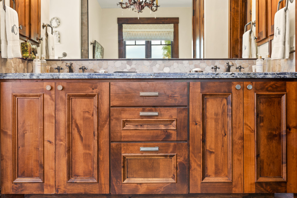 Bathroom - mid-sized rustic double-sink bathroom idea with granite countertops