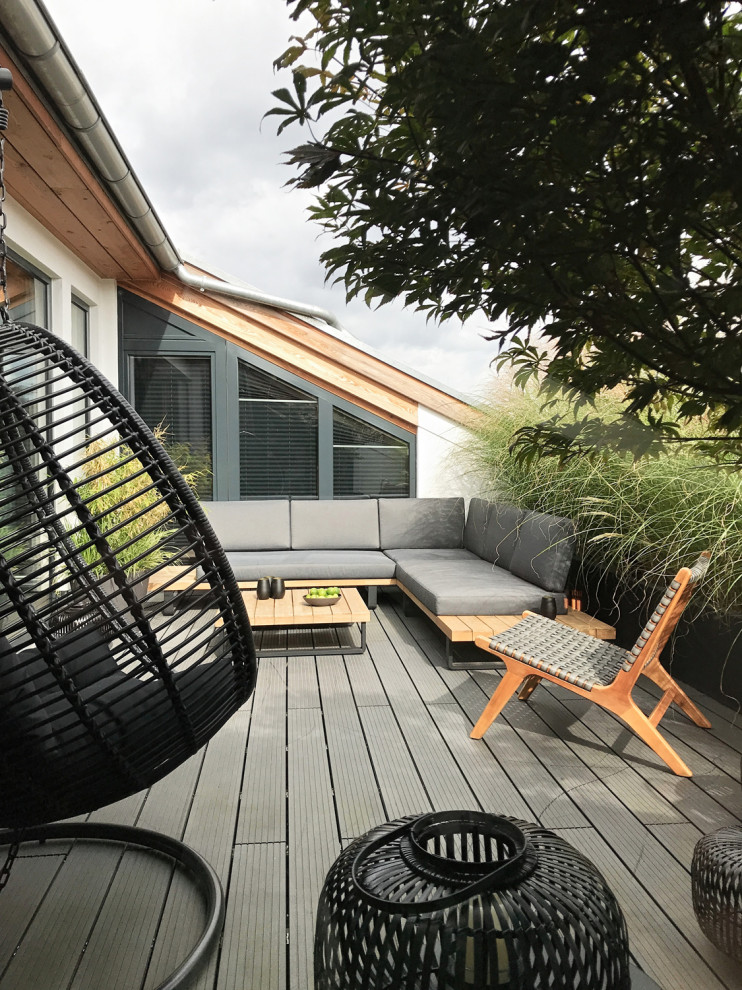 Modelo de terraza minimalista grande en azotea con iluminación
