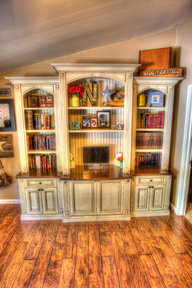 Inspiration for a mid-sized rustic freestanding desk dark wood floor home office remodel with beige walls