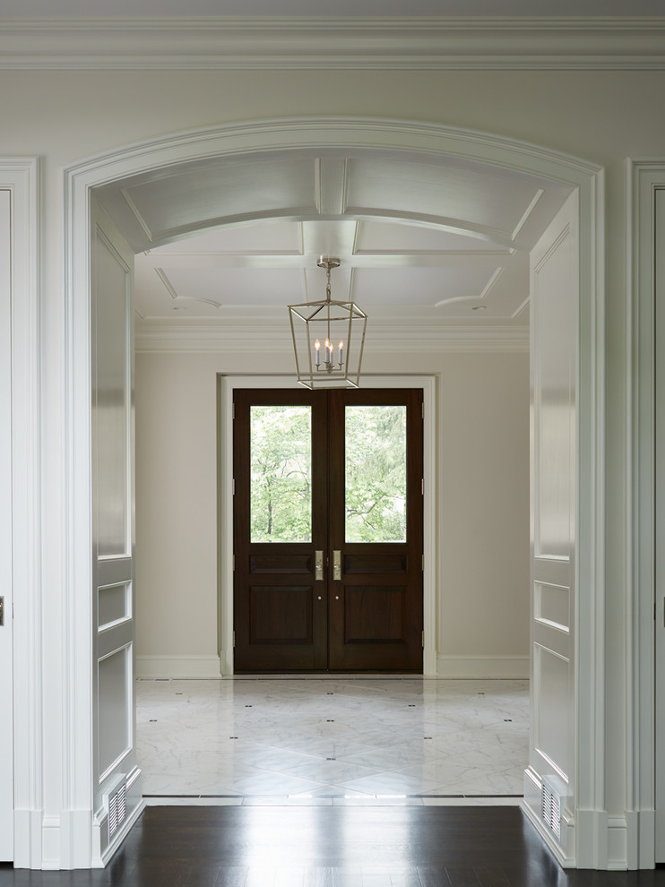 Inspiration for a transitional dark wood floor foyer remodel in Chicago with a dark wood front door