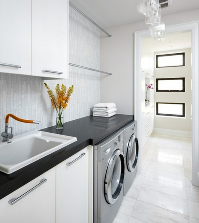 Laundry room - transitional laundry room idea with flat-panel cabinets, white cabinets, granite countertops, gray walls and a side-by-side washer/dryer