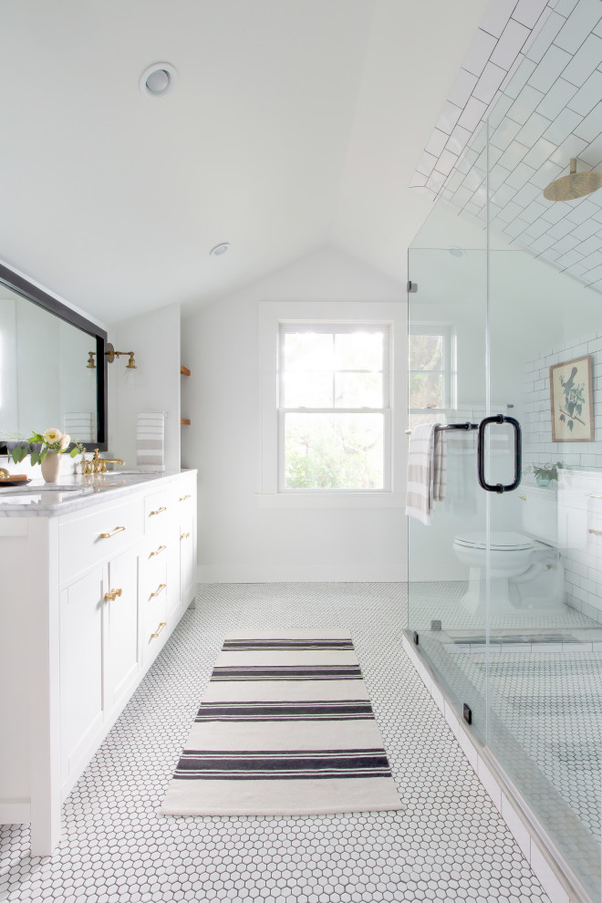 Inspiration for a transitional master bathroom in Atlanta with shaker cabinets, white cabinets, a double shower, a two-piece toilet, white tile, porcelain tile, white walls, an undermount sink, marble benchtops, white floor, a hinged shower door, grey benchtops, a niche, a double vanity and a freestanding vanity.