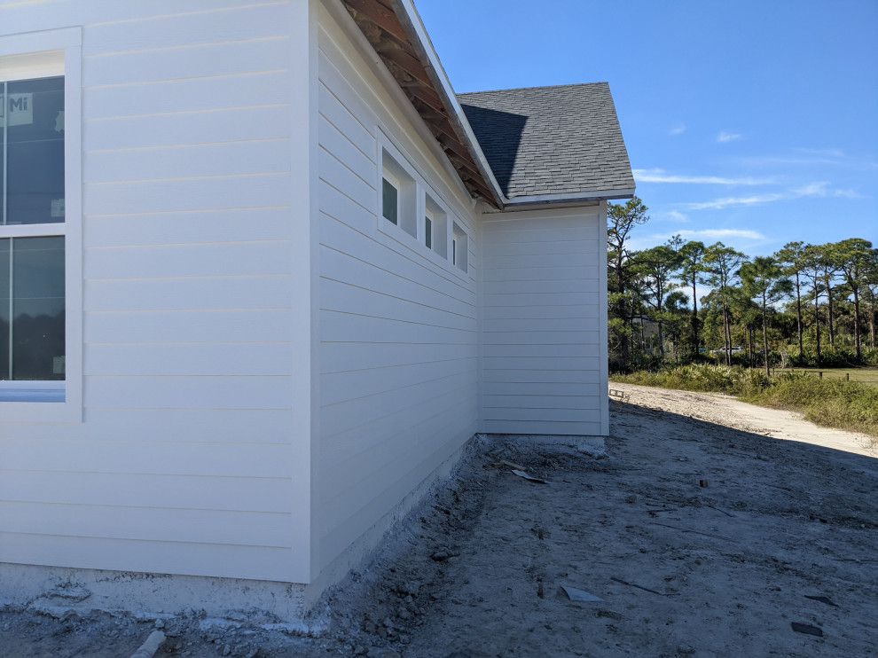 Between the hardie board and concrete block? AFTER construction...