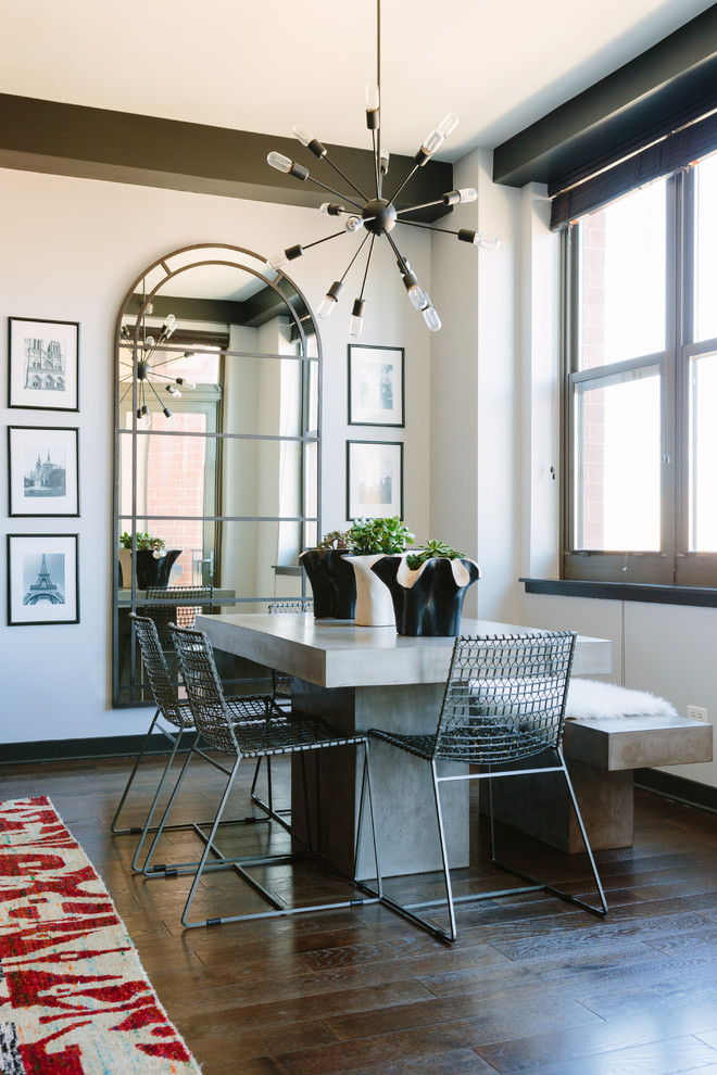 Inspiration for a transitional dining room in Chicago with white walls, dark hardwood floors and brown floor.