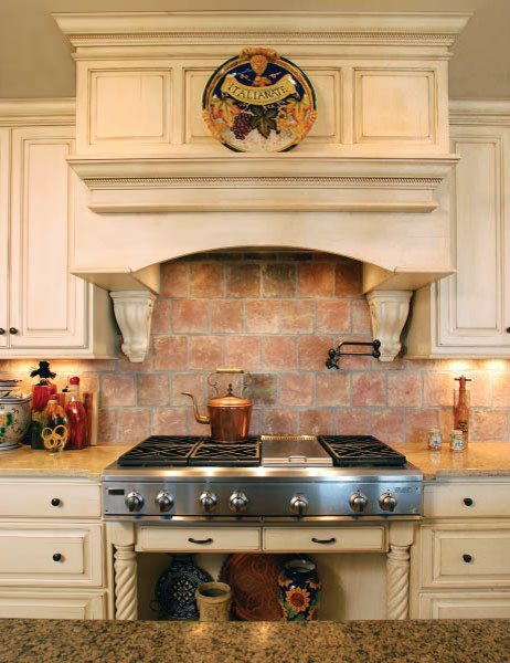 Inspiration for a transitional eat-in kitchen remodel in Indianapolis with white cabinets, granite countertops, multicolored backsplash, stainless steel appliances and an island