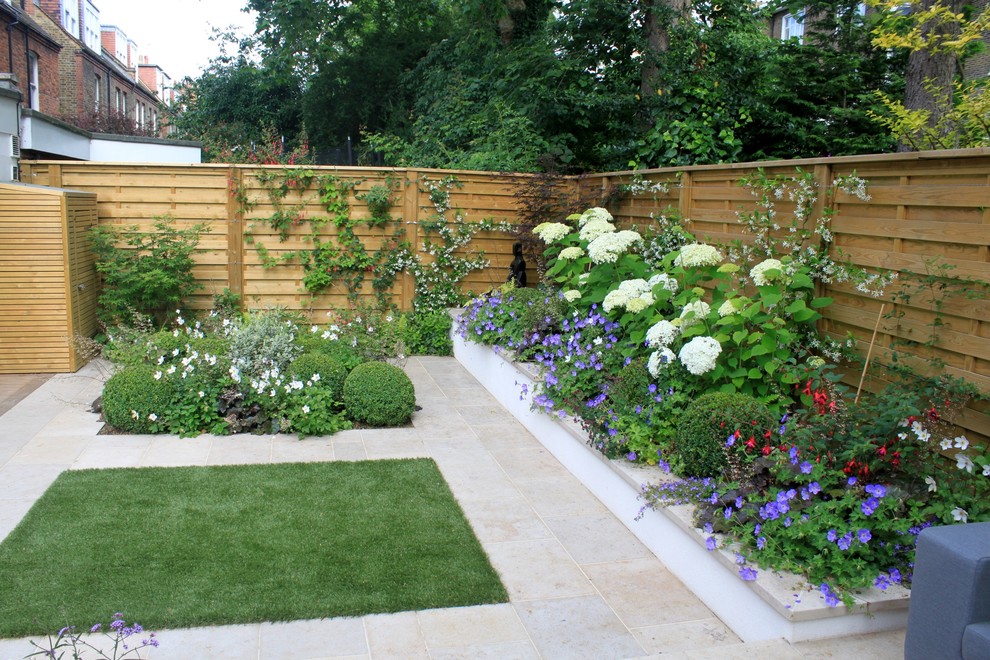 Small contemporary backyard formal garden in London with concrete pavers.