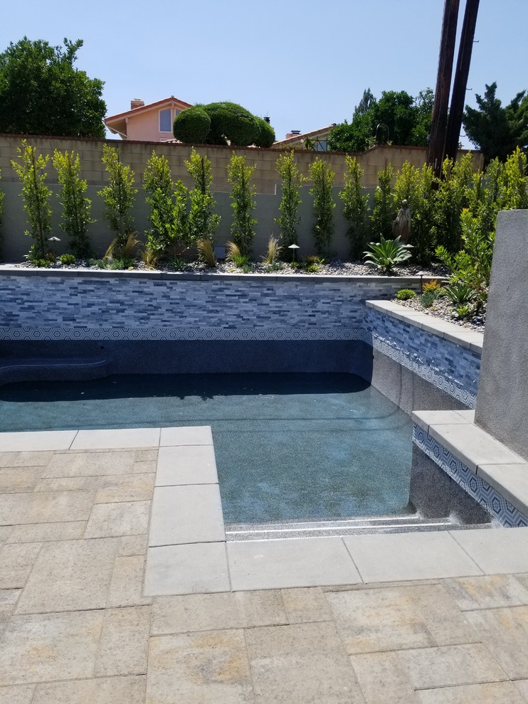 Inspiration for a transitional pool remodel in Orange County