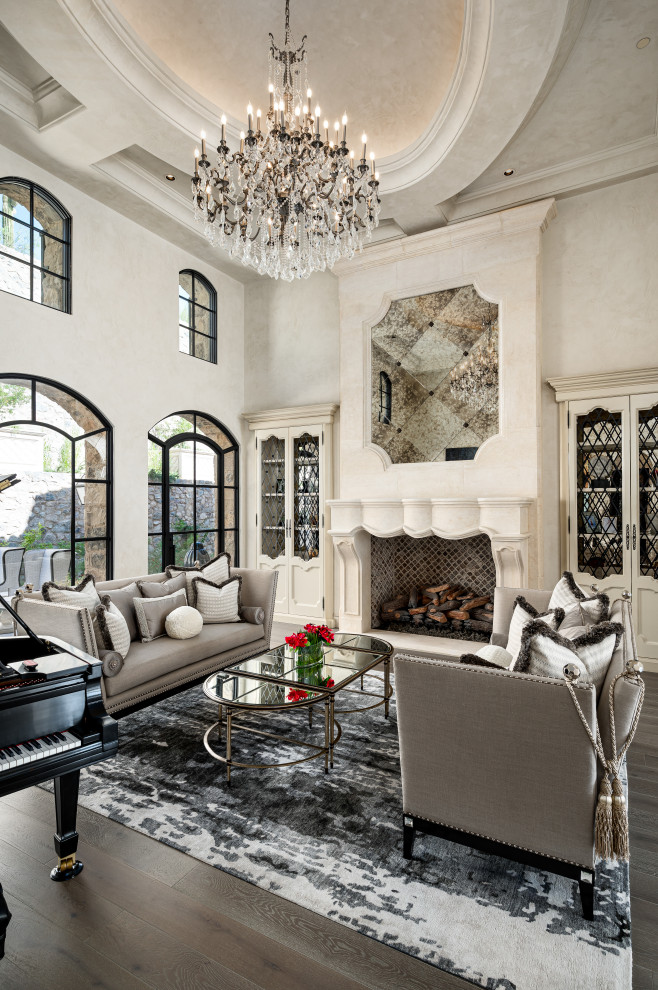 Design ideas for an open concept living room in Phoenix with beige walls, dark hardwood floors, a standard fireplace, brown floor and recessed.