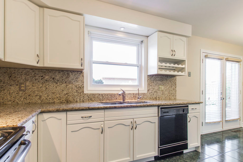 Example of a transitional kitchen design in Toronto