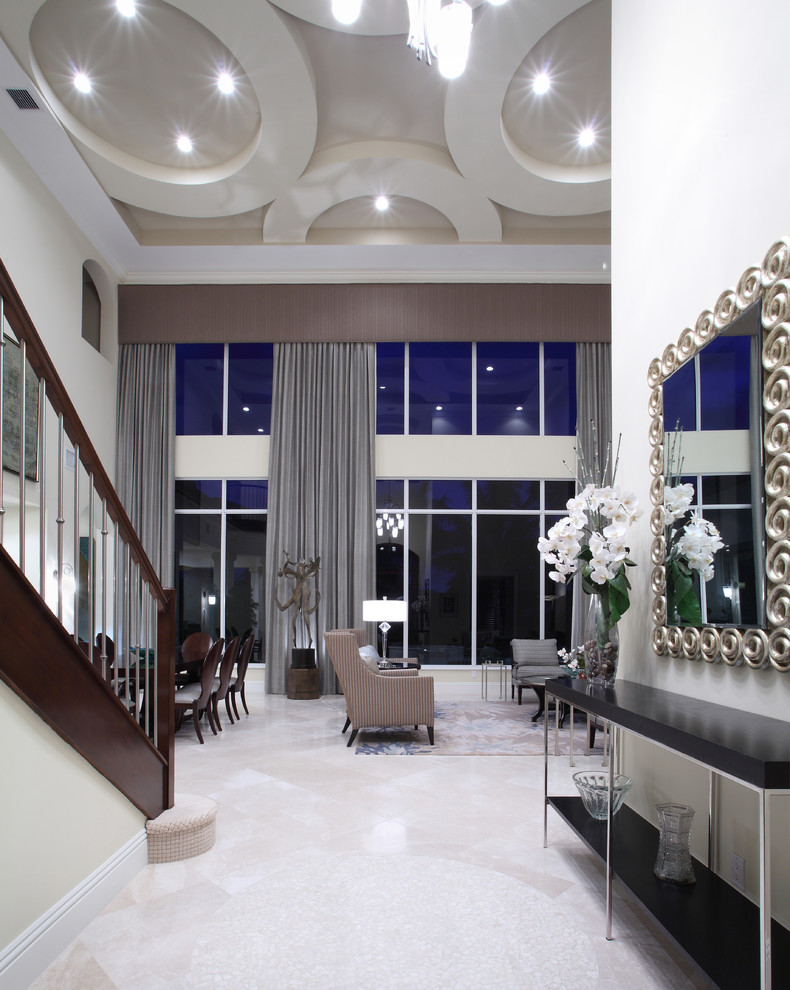 Mid-sized transitional entry hall in Miami with white walls.