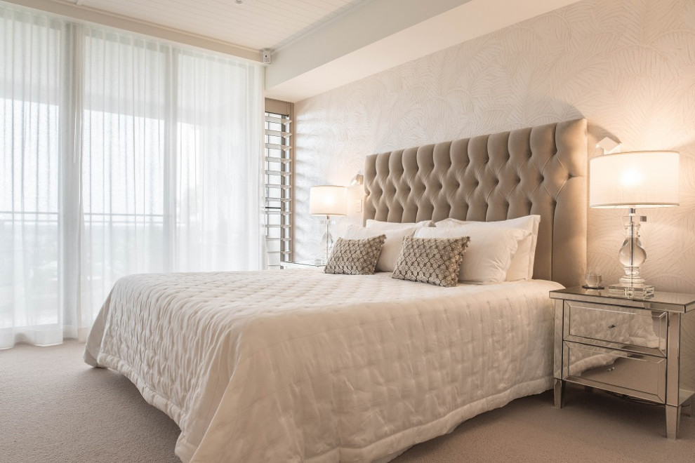 Inspiration for a mid-sized contemporary master bedroom in Sunshine Coast with white walls, carpet, beige floor and wallpaper.