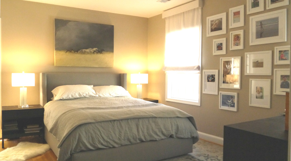 Photo of a mid-sized transitional master bedroom in DC Metro with beige walls, light hardwood floors and no fireplace.