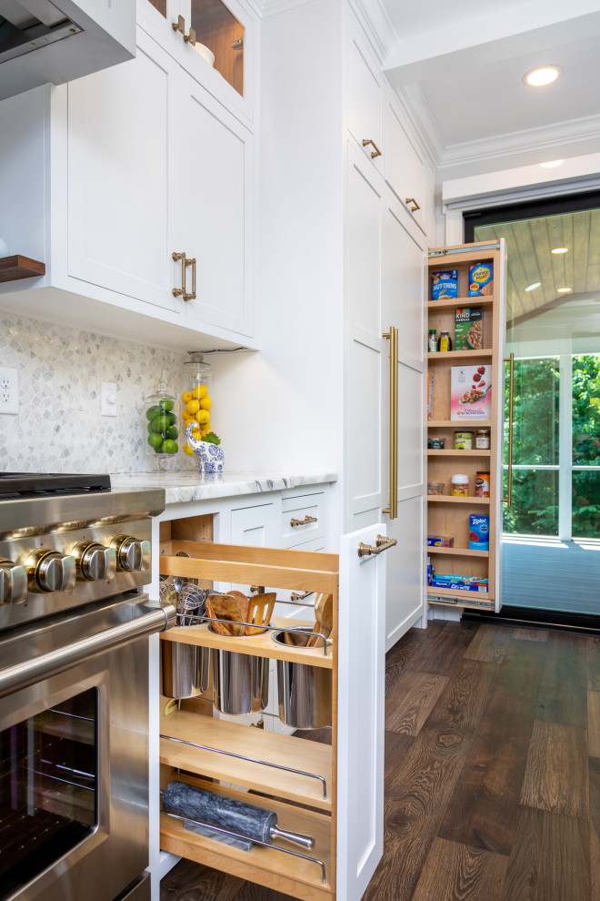 Mid-sized transitional single-wall medium tone wood floor, brown floor and exposed beam open concept kitchen photo in Raleigh with a single-bowl sink, shaker cabinets, white cabinets, quartzite countertops, gray backsplash, mosaic tile backsplash, paneled appliances, an island and multicolored countertops