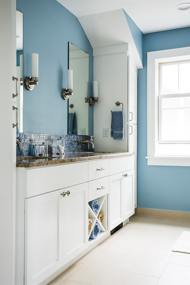 Photo of a mid-sized transitional master bathroom in Minneapolis with recessed-panel cabinets, white cabinets, an open shower, a one-piece toilet, blue tile, mosaic tile, blue walls, ceramic floors, an undermount sink and granite benchtops.
