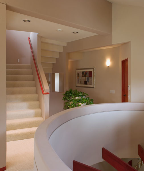 This is an example of a small transitional carpeted u-shaped staircase in San Diego with carpet risers.
