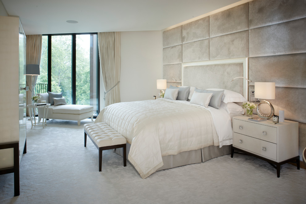 Design ideas for a mid-sized contemporary bedroom in London with carpet and white walls.