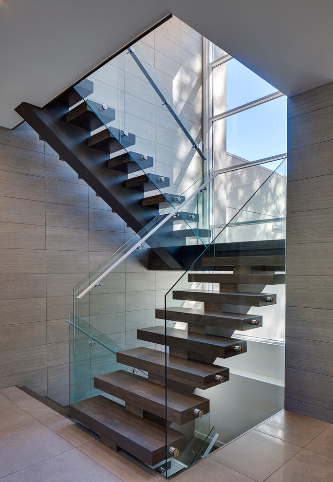 Design ideas for a mid-sized contemporary wood floating staircase in Chicago with open risers.