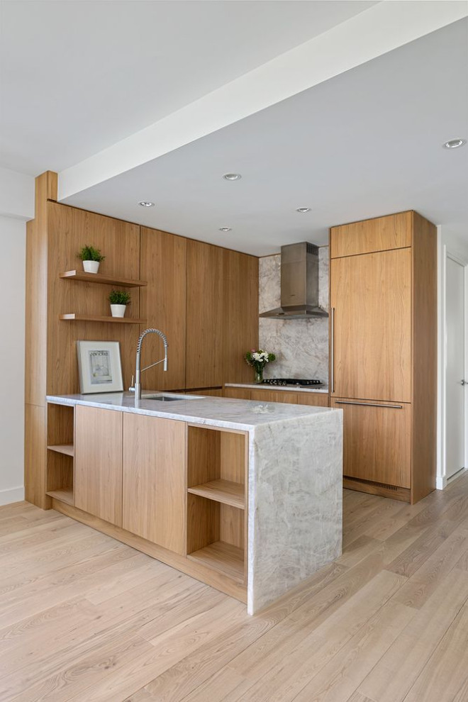 Design ideas for a small modern u-shaped eat-in kitchen in New York with an undermount sink, flat-panel cabinets, light wood cabinets, quartzite benchtops, white splashback, light hardwood floors, white benchtop and a peninsula.