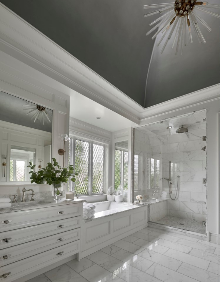 Inspiration for an expansive beach style master bathroom in Chicago with flat-panel cabinets, white cabinets, an alcove tub, an alcove shower, a one-piece toilet, marble, white walls, an undermount sink, marble benchtops, a hinged shower door, white benchtops, a double vanity and a built-in vanity.
