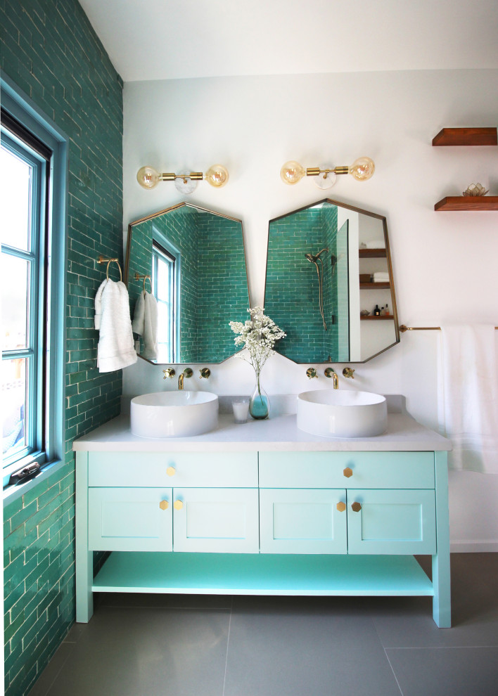 Inspiration for a transitional bathroom in Los Angeles with shaker cabinets, turquoise cabinets, blue tile, white walls, a vessel sink, grey benchtops, a double vanity and a freestanding vanity.