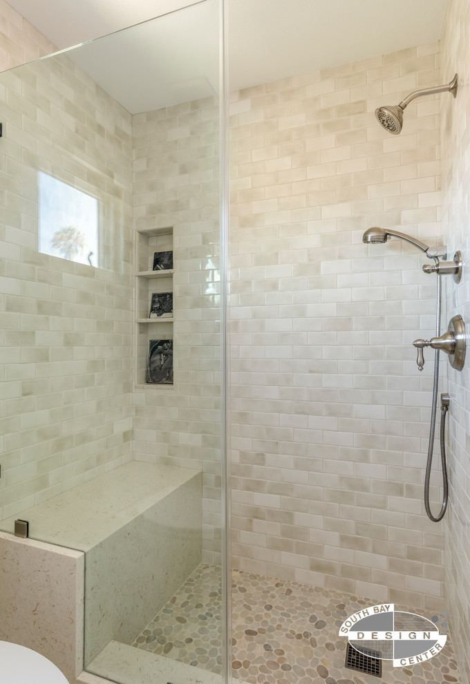 This is an example of a mid-sized transitional master bathroom in Los Angeles with shaker cabinets, white cabinets, an alcove tub, a shower/bathtub combo, a two-piece toilet, blue tile, ceramic tile, white walls, ceramic floors, an undermount sink, engineered quartz benchtops, beige floor and a shower curtain.
