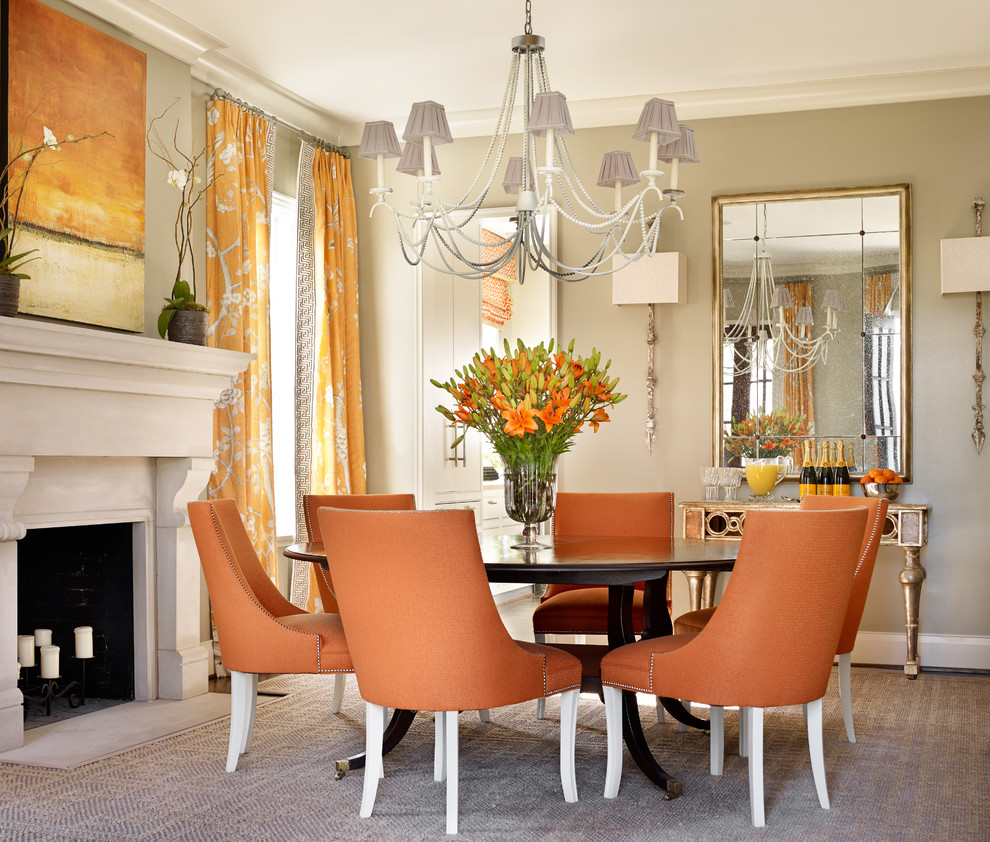 Example of a large transitional carpeted dining room design in Birmingham with beige walls and a standard fireplace