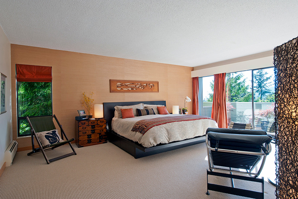 This is an example of a large asian master bedroom in Vancouver with beige walls, carpet, no fireplace and beige floor.