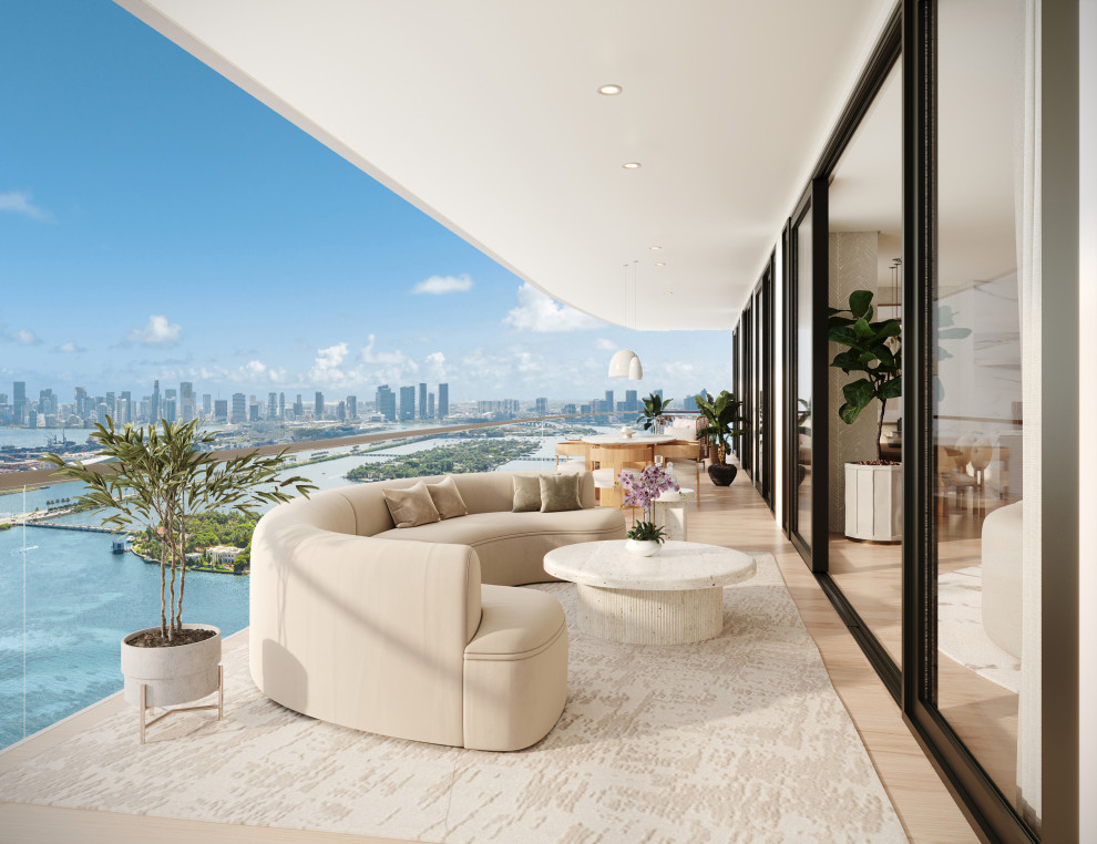 Inspiration for a large modern apartment and glass railing balcony remodel in Miami with a roof extension