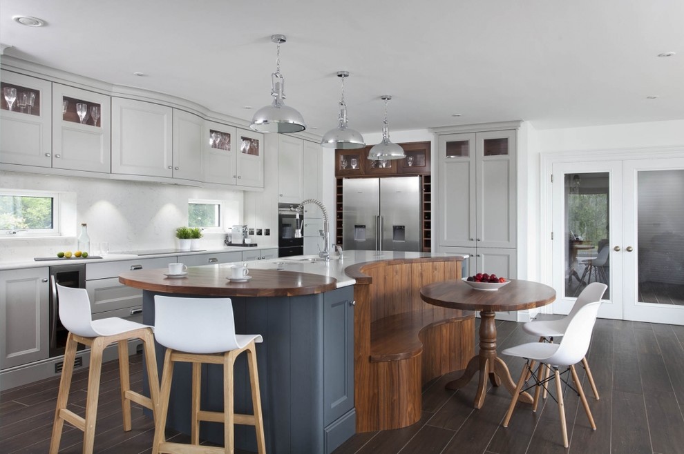 Inspiration for a transitional l-shaped kitchen in Other with recessed-panel cabinets, grey cabinets, wood benchtops, white splashback, stainless steel appliances, dark hardwood floors and with island.