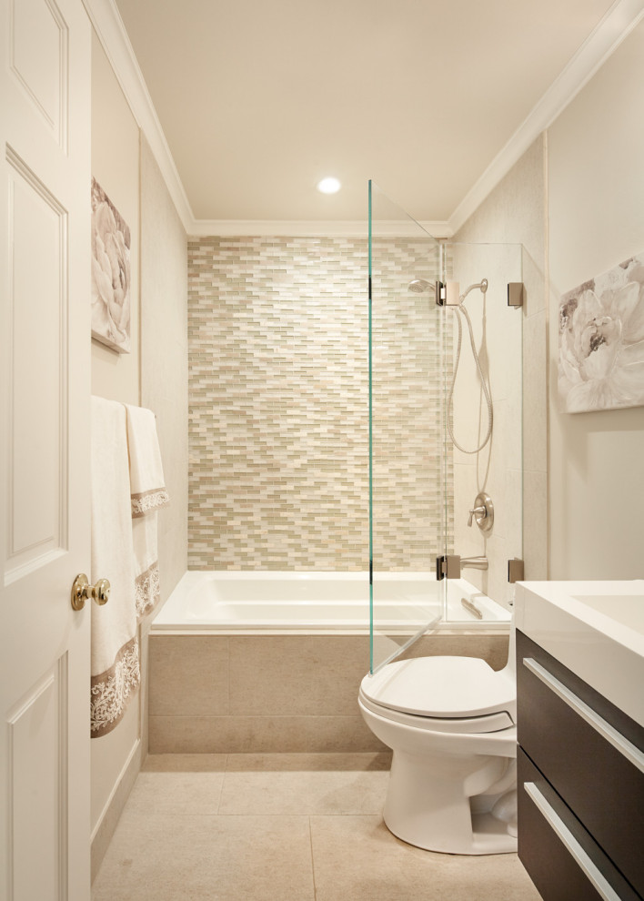 Photo of a mid-sized beach style bathroom in San Francisco with flat-panel cabinets, brown cabinets, a drop-in tub, an alcove shower, a one-piece toilet, multi-coloured tile, matchstick tile, grey walls, porcelain floors, a trough sink, solid surface benchtops, beige floor, an open shower, white benchtops, a single vanity and a floating vanity.