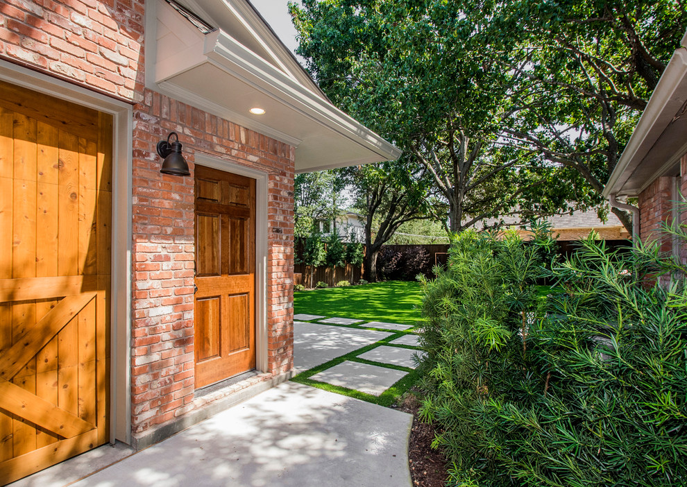 Mid-sized traditional detached two-car garage in Dallas.