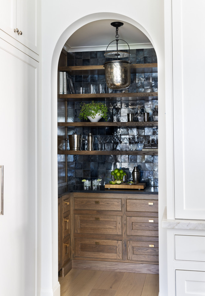 Inspiration for a transitional home bar remodel in Houston