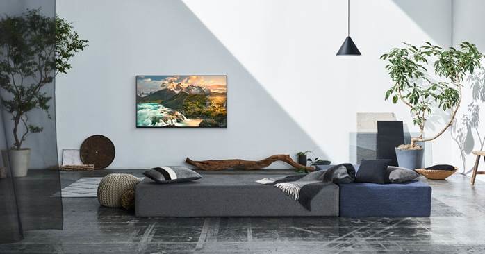 Photo of a mid-sized scandinavian formal open concept living room in Other with white walls, concrete floors, no fireplace, no tv and grey floor.
