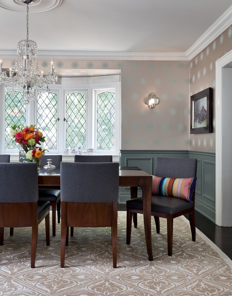 Transitional separate dining room in Toronto with dark hardwood floors and multi-coloured walls.