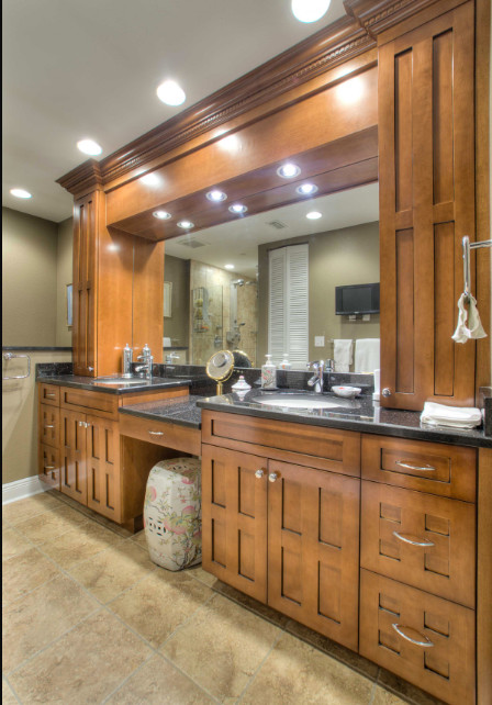 Design ideas for a large traditional master bathroom in Tampa with recessed-panel cabinets, medium wood cabinets, an alcove shower, a one-piece toilet, linoleum floors, an undermount sink, granite benchtops, beige floor, a hinged shower door, black benchtops, a double vanity, a built-in vanity and grey walls.