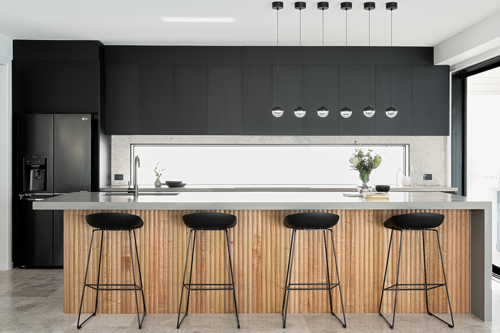 Mid-sized contemporary galley kitchen in Brisbane with an undermount sink, flat-panel cabinets, black cabinets, window splashback, stainless steel appliances, porcelain floors, with island, grey floor and grey benchtop.