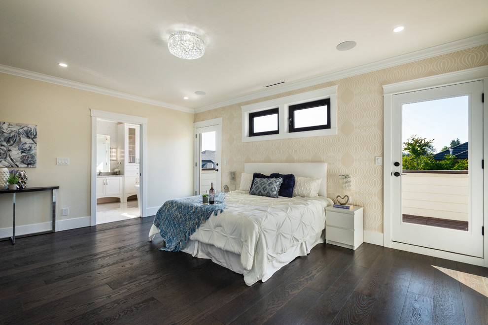Photo of a large traditional master bedroom in Vancouver with yellow walls, dark hardwood floors and black floor.
