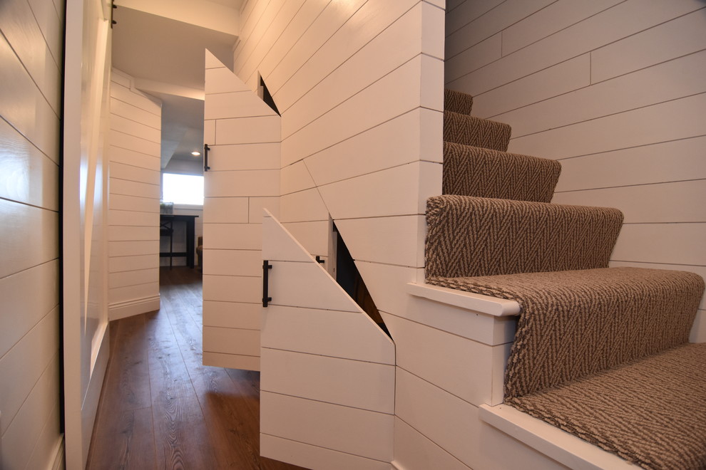 This is an example of a beach style basement in Other.