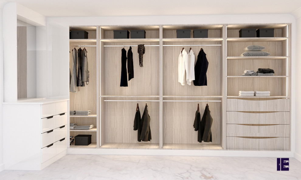 This is an example of a small contemporary built-in wardrobe in London with flat-panel cabinets, white cabinets, marble flooring, white floors and feature lighting.