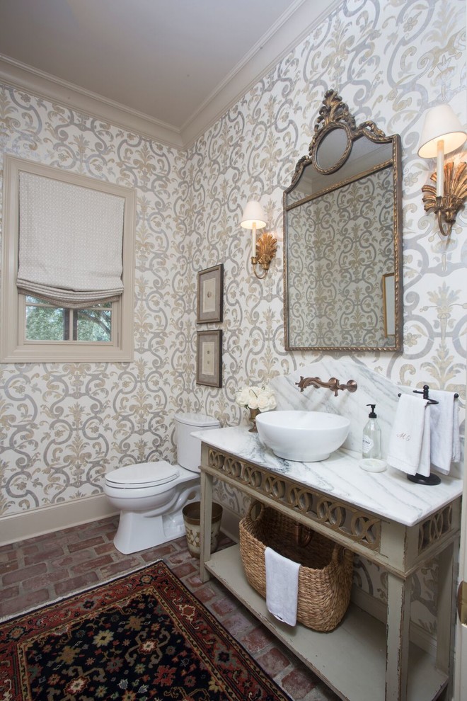Design ideas for a mid-sized traditional powder room in New Orleans with multi-coloured walls, a vessel sink and marble benchtops.